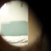 A view of the infamously haunted room B340 through the missing peep-hole.