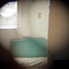 A composite photo of the infamously haunted room B340, composed from four pictures through the missing peep-hole.